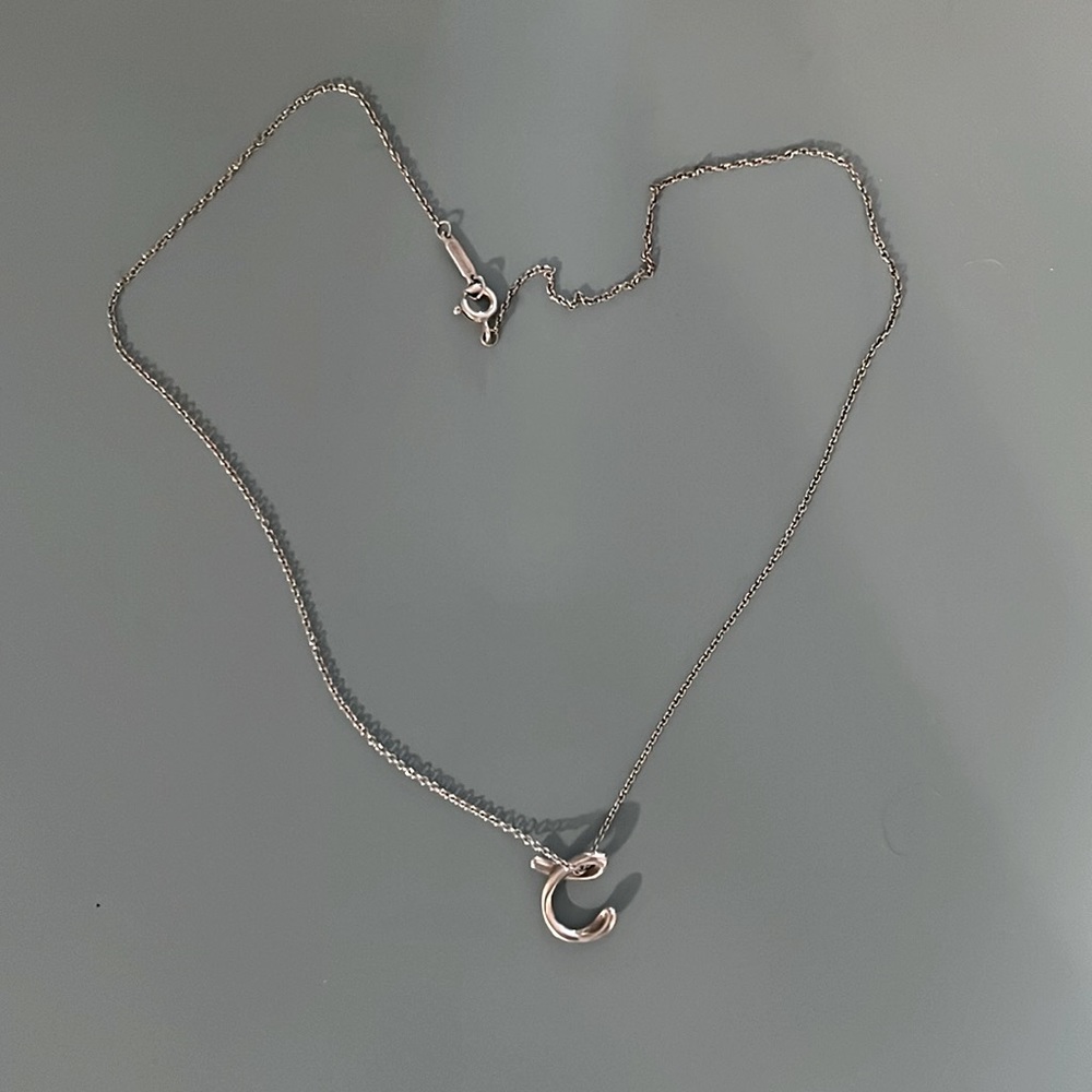 Tiffany and Co. Elsa Peretti® Alphabet Letter C Pendant
in Silver, Small.
